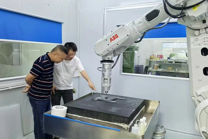 ABB six-axis robotic polishing system for optical mold surface finishing