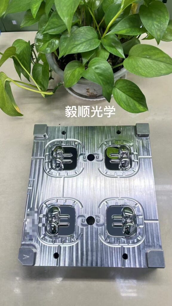 Four-cavity Bluetooth earbud housing mold with mirror-polished inserts