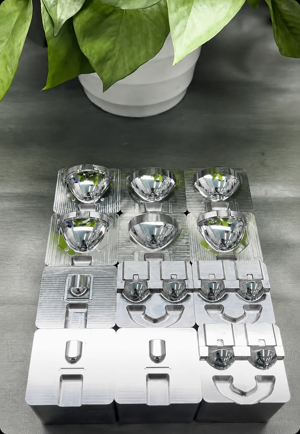 Actual YISHUN reflector mold insert family showing multiple matched reflector cavity configurations